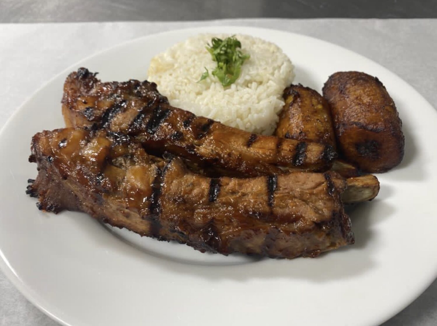 Tender Pork Spare Ribs, Rice, Beans & Plantain