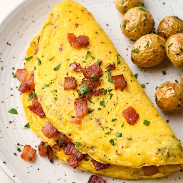 OMLETTE (PEPPERS, ONIONS, TOMATOES, CHEESE) W/ SIDE OF BACON AND HOME FIRES